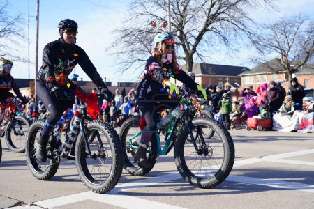 Photo for Green Bay, Wisconsin / USA - November 23rd, 2019: Fat Tire bike group part take and riding around in 36th Annual Prevea Green Bay Holiday Christmas Parade hosted by Downtown Green Bay. - Royalty Free Image