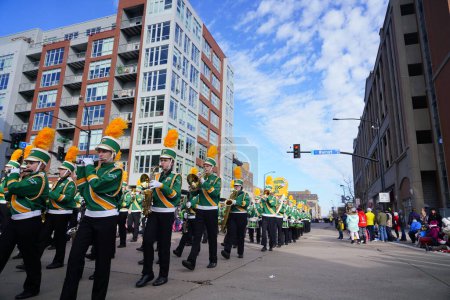 Photo for Green Bay, Wisconsin / USA - November 23rd, 2019: Green Bay Preble High School Hornets musical marching band marched in 36th Annual Prevea Green Bay Holiday Parade hosted by Downtown Green Bay. - Royalty Free Image