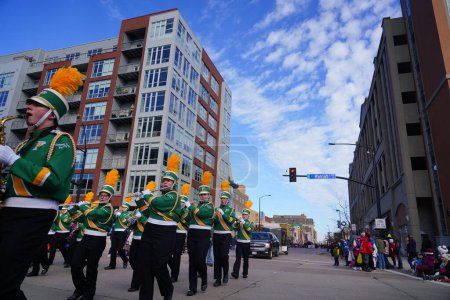 Photo for Green Bay, Wisconsin / USA - November 23rd, 2019: Green Bay Preble High School Hornets musical marching band marched in 36th Annual Prevea Green Bay Holiday Parade hosted by Downtown Green Bay. - Royalty Free Image
