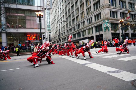 Photo for Chicago, Illinois / USA - November 28th 2019: Jonesboro, Georgia High School the Cardinals Musical Marching band marched in 2019 Uncle Dan's Chicago Thanksgiving Parade. - Royalty Free Image