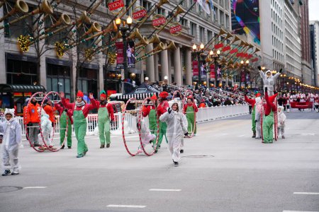 Photo for Chicago, Illinois / USA - November 28th 2019: Chicago Wheel Jam by Cirques Experience specializes in Wheel Gymnastics performed in 2019 Uncle Dan's Chicago Thanksgiving Parade. - Royalty Free Image