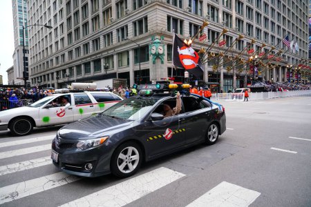 Photo for Chicago, Illinois USA - November 23rd, 2023: Windy City Ghostbusters dressed up in costumes of Ghostbusters in the cars and participated in 2023 Chicago Thanksgiving Parade. - Royalty Free Image