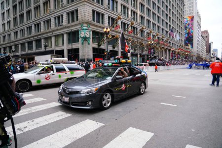 Photo for Chicago, Illinois USA - November 23rd, 2023: Windy City Ghostbusters dressed up in costumes of Ghostbusters in the cars and participated in 2023 Chicago Thanksgiving Parade. - Royalty Free Image