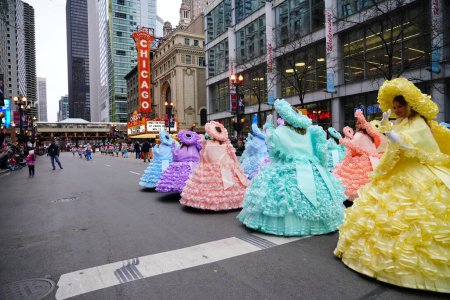 Photo for Chicago, Illinois / USA - November 28th 2019: Members of the Mobile Azalea Trail maids show off their dresses at 2019 Uncle Dan's Chicago Thanksgiving Parade. - Royalty Free Image