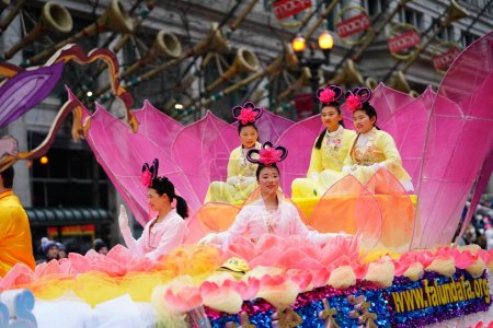 Photo for Chicago, Illinois USA - November 23rd, 2023: Members of Falun Dafa Chicago, Falun Gong Chicago a Chinese religion practice participate in 2023 Chicago Thanksgiving Day Parade - Royalty Free Image