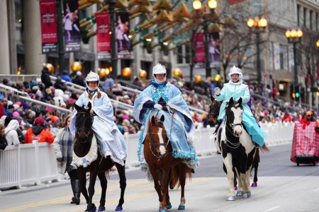 Photo for Chicago, Illinois USA - November 23rd, 2023: Members of Falun Dafa Chicago, Falun Gong Chicago a Chinese religion practice participate in 2023 Chicago Thanksgiving Day Parade - Royalty Free Image