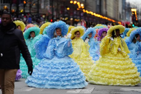 Photo for Chicago, Illinois / USA - November 28th 2019: Members of the Mobile Azalea Trail maids show off their dresses at 2019 Uncle Dan's Chicago Thanksgiving Parade. - Royalty Free Image