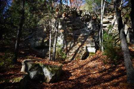 Photo for Rock stone formations sit in a forest for rock climbing. - Royalty Free Image