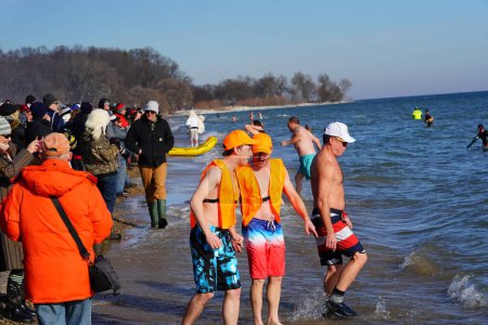 Photo for Milwaukee, Wisconsin / USA - January 1st, 2020: Many community members participated in Polar Bear Plunge into the freezing waters of Lake Michigan during the cold winter season. - Royalty Free Image