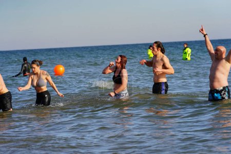 Photo for Milwaukee, Wisconsin / USA - January 1st, 2020: Many community members participated in Polar Bear Plunge into the freezing waters of Lake Michigan during the cold winter season. - Royalty Free Image