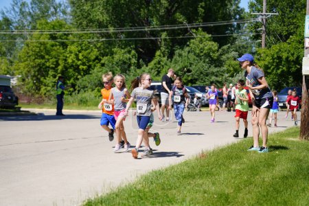 Photo for Fond du Lac, Wisconsin / USA - June 8th, 2019: Young kids boy and girls ran in the youth walleye weekend running marathon. - Royalty Free Image