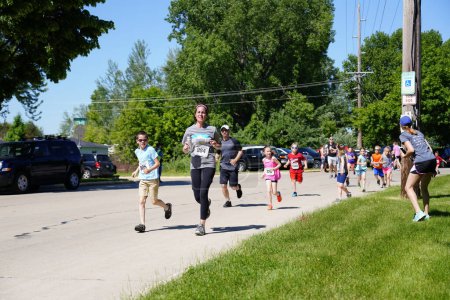 Photo for Fond du Lac, Wisconsin / USA - June 8th, 2019: Young kids boy and girls ran in the youth walleye weekend running marathon. - Royalty Free Image