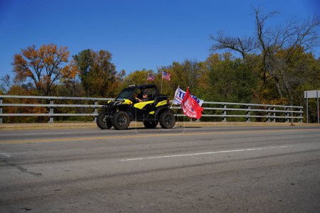 Photo for Mauston, Wisconsin / USA - October 10th, 2020: 45th president trump supporters in atvs and utvs traveled through mauston showing their support. - Royalty Free Image