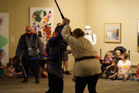 Photo for Manitowoc, Wisconsin / USA - September 7th, 2019: 501st Midwest Garrison Star Wars theme costume wearers attended the annual Sputnikfest bringing joy to many attendees and children at the event - Royalty Free Image