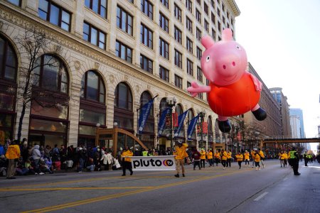 Photo for Chicago, Illinois USA - November 23rd, 2023: Members of the Chicago Thanksgiving Day Parade pulled balloon through State Street. - Royalty Free Image