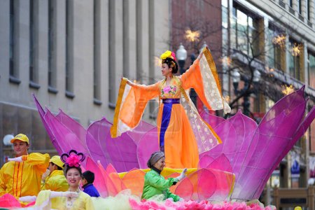 Photo for Chicago, Illinois USA - November 23rd, 2023: Members of Falun Dafa Chicago, Falun Gong Chicago a Chinese religion practice participate in 2023 Chicago Thanksgiving Day Parade. - Royalty Free Image