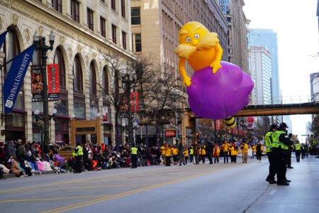 Photo for Chicago, Illinois USA - November 23rd, 2023: Members of the Chicago Thanksgiving Day Parade pulled balloon through State Street. - Royalty Free Image