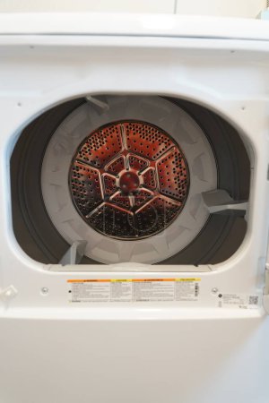 Photo for Fond du Lac, Wisconsin USA - February 1st, 2023: GE washing machine and GE clothes dryer sits in the laundry room. - Royalty Free Image