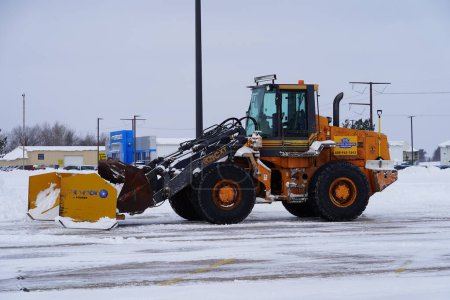 Photo for Mauston, Wisconsin USA - January 15th, 2024: Full size Case wheel loader sits out in the Winter snow ready to be used. - Royalty Free Image