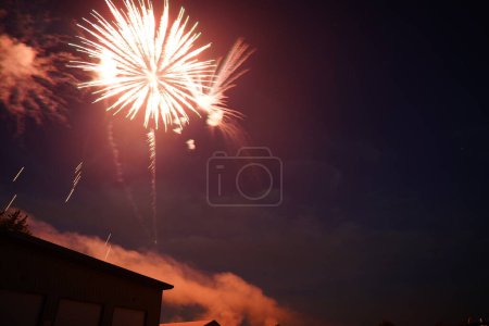 Photo for Fireworks lite up the dark sky over Fisk, Wisconsin the day before 4th of July independence day of America - Royalty Free Image