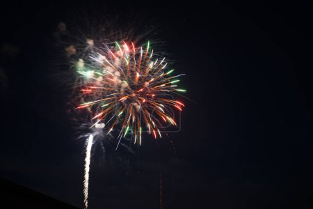 Fireworks lite up the dark sky over Fisk, Wisconsin the day before 4th of July independence day of America