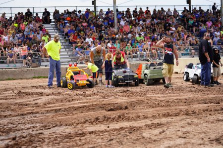 Photo for Pickett, Wisconsin / USA - September 18th, 2020: Power wheels with kids driven in hollywood motorsports entertainment annual paws for the cause demolition derb - Royalty Free Image