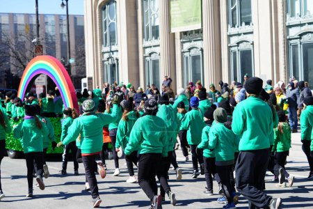 Photo for Milwaukee, Wisconsin USA - March 12th, 2022: Members from Beglan Academy of Irish dance danced in St. Patrick's Day parade. - Royalty Free Image