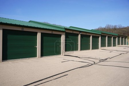 Green and tan storage units service the community to hold owners property.