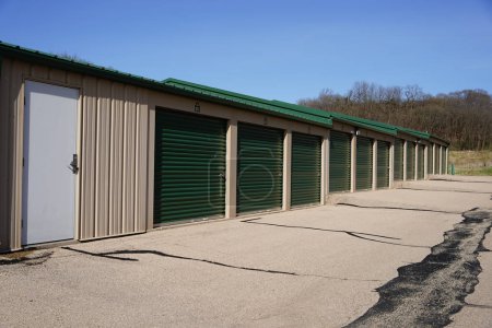 Green and tan storage units service the community to hold owners property.