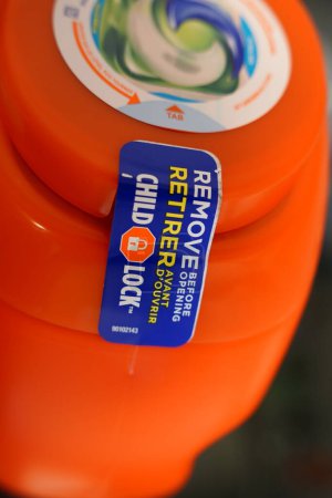 Photo for Fond du Lac, Wisconsin USA - April 11th, 2024: Tide Pods laundry detergent container with child lock tag. - Royalty Free Image