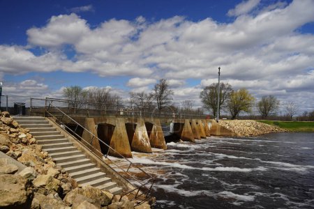 Photo for Stone water way dam on a Wisconsin river during early spring - Royalty Free Image