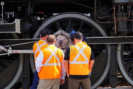 Foto de Tomah, Wisconsin USA - May 5th, 2024: Train crew did doing maintenance to Canadian Pacific 2816 Empress locomotive steam engine train. - Imagen libre de derechos