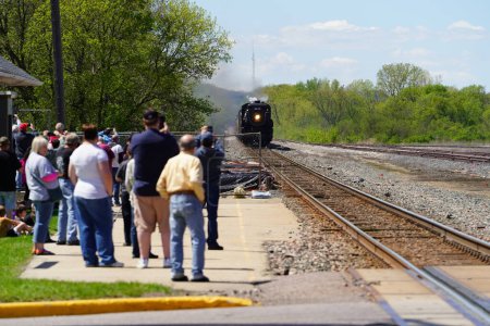 Foto de Tomah, Wisconsin USA - May 5th, 2024: People waited at an Amtrak train depot to take their ride. - Imagen libre de derechos