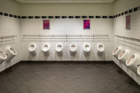 Photo for In a toilet there are many urinals next to each other - Royalty Free Image