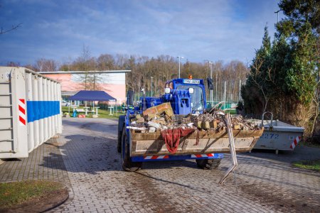 Photo for Members of THW remove construction debris with the help of a wheel loader in Schoenberg, Deutschland - Royalty Free Image