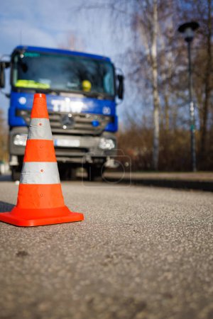 Photo for In front of the blue vehicle of the technical relief organization THW is an orange pylon - Royalty Free Image