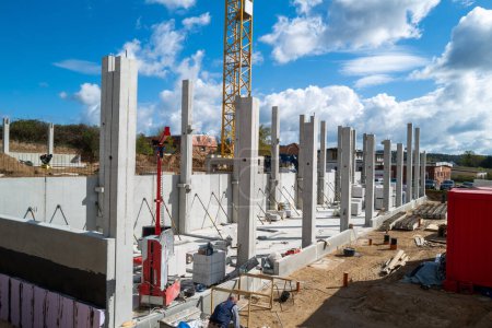 many concrete pillars for a factory building are erected on a construction site