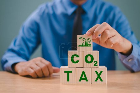 Photo for CO2 tax law, Carbon credit tax, environmental social governance responsibility business concept. Taxation calculator budget, earth pollution. Investment fund, green business carbon emission, ESG - Royalty Free Image