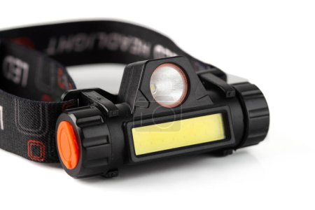 Head Torch flashlight on white background isolation. Light battery operated lamp worn on head.
