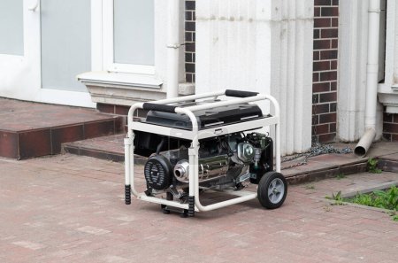 Power supply generator placed on street sidewalk. outdoor diesel power generator in Ukraine