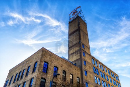 Photo for Minneapolis, Minnesota - October 31, 2022: Sign for North Star Blankets, against a blue sky. This former woolen mill has now been converted into the North Star Loft apartments - Royalty Free Image