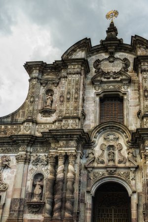Photo for The facade of the Church of the Society of Jesus (La Iglesia de la Compania de Jesus) in the city of Quito, in Ecuador, South America - Royalty Free Image