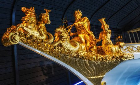 Photo for Amsterdam, The Netherlands - 23 April 2023: Gold statue on bowsprit of baroque dutch medieval royal boat in The National Maritime Museum. - Royalty Free Image