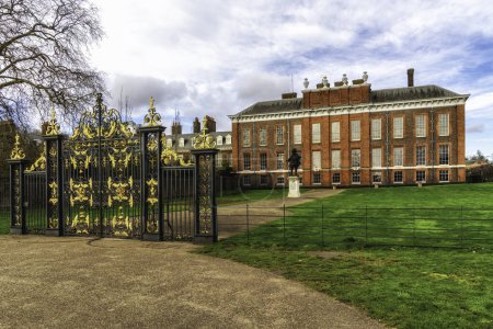 A view of the magnificent Kensington Palace in London with the statue of King William III in the foreground, London, UK