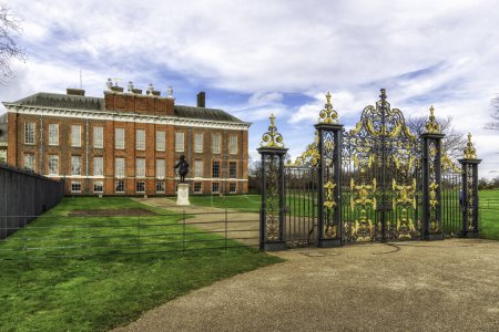 A view of the magnificent Kensington Palace in London with the statue of King William III in the foreground, London, UK