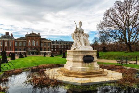 Kensington palace and Queen Victoria monument in London, UK