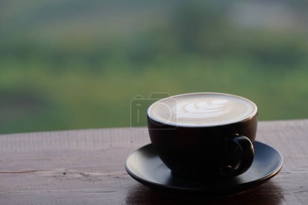 Photo for Cup with coffee on wooden table - Royalty Free Image