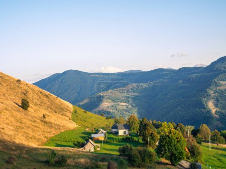 Village in Transcarpathia region scenic Carpathian mountains view Ukraine, Europe. Autumn countryside landscape fall spruce pine trees. Eco Local tourism hiking Recreational activities Vacation