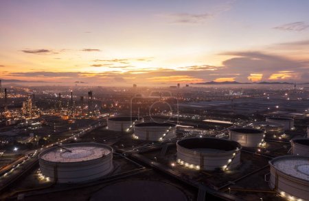 Photo for Aerial view drone of oil storage tank with oil refinery factory industrial. Oil refinery plant at beautiful sky sunset and twilight. industry factory concept and transportation. - Royalty Free Image