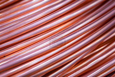 Twisted copper cable, close-up. Closeup of spiral copper cable with soft focus background. Copper wire randomly wound into a coil.